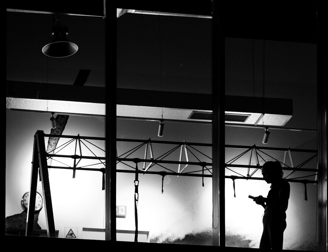 Production crew setting up lighting rigs in a television studio